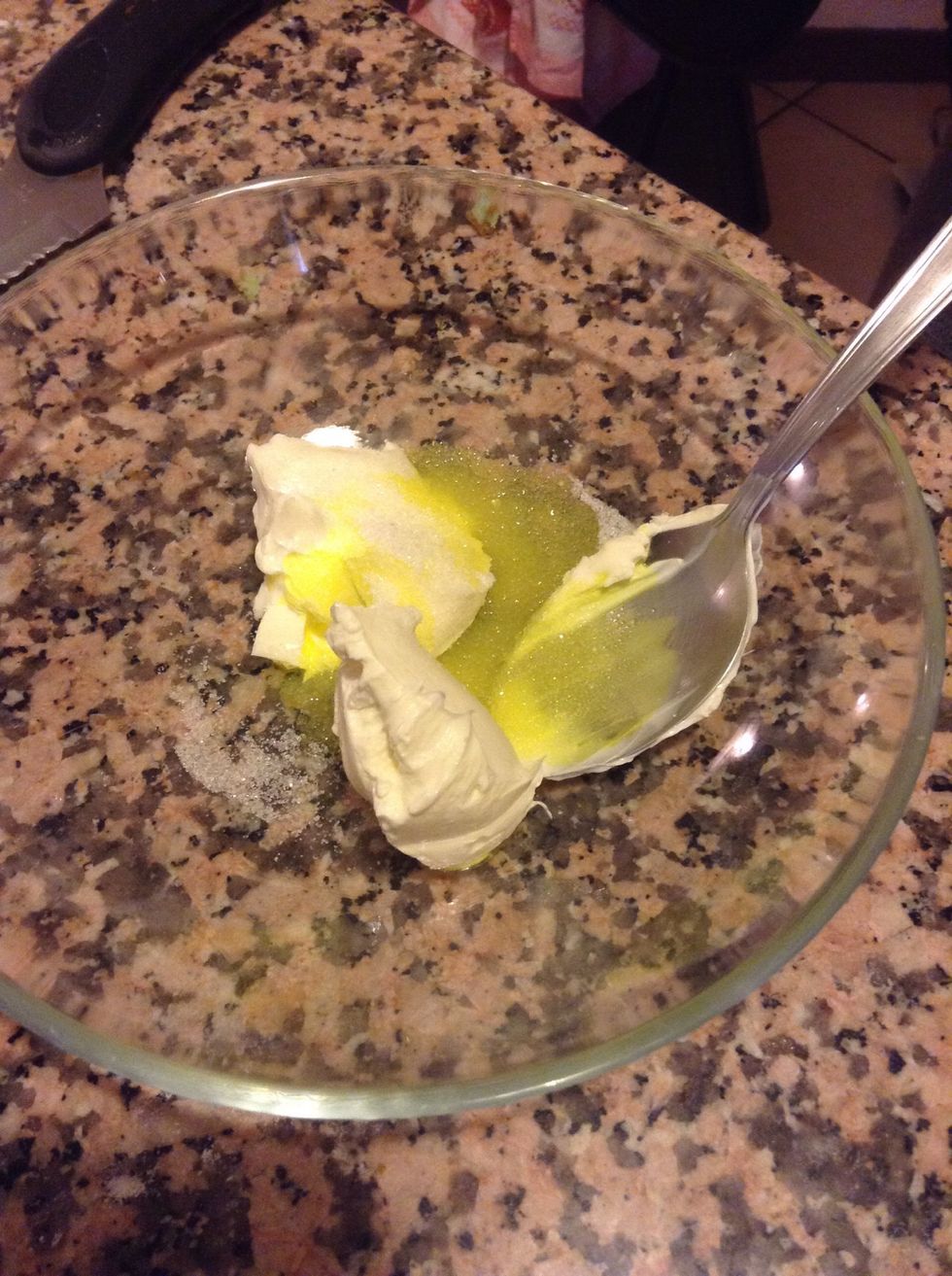 Mix together your cream cheese, the remained sugar and yellow colouring.