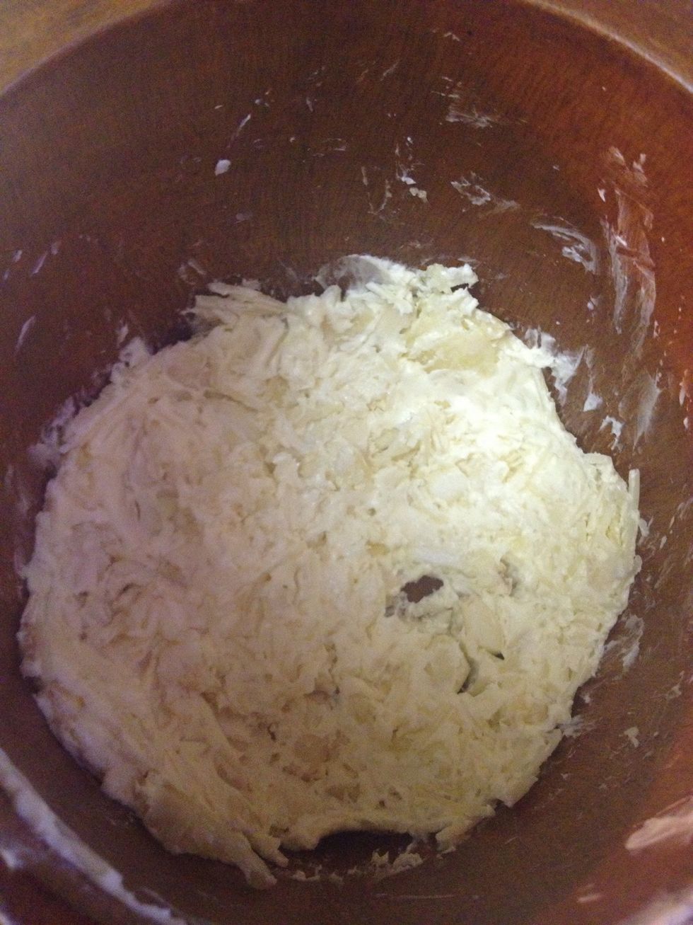 Mix together your crushed garlic, a stick of butter and about 1/3 cup of Parmesan to create a paste.