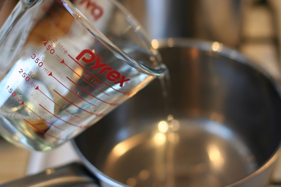 Mix vinegar, oil, water, salt, and spices together in a pot.   For every 1 cup of vinegar, use: 1/4 cup water, 1/4 cup olive oil, 1 teaspoon salt, 1 teaspoon pickling spices