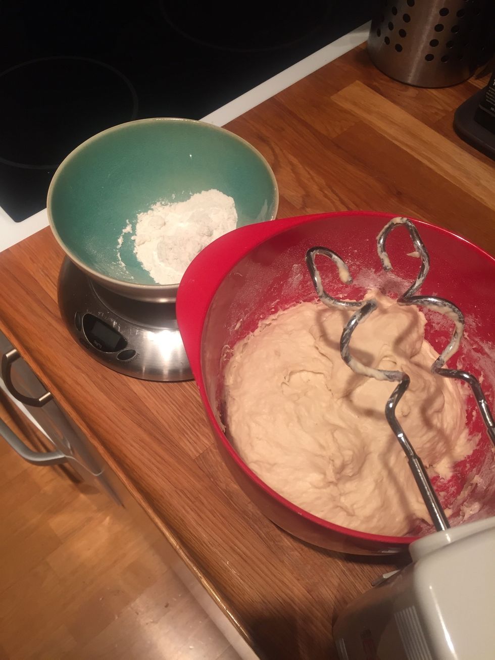 Mix water and yeast, add egg and then all but 50g of flour. Weigh all ingredients. Turn the oven on at 225 degrees Celsius.