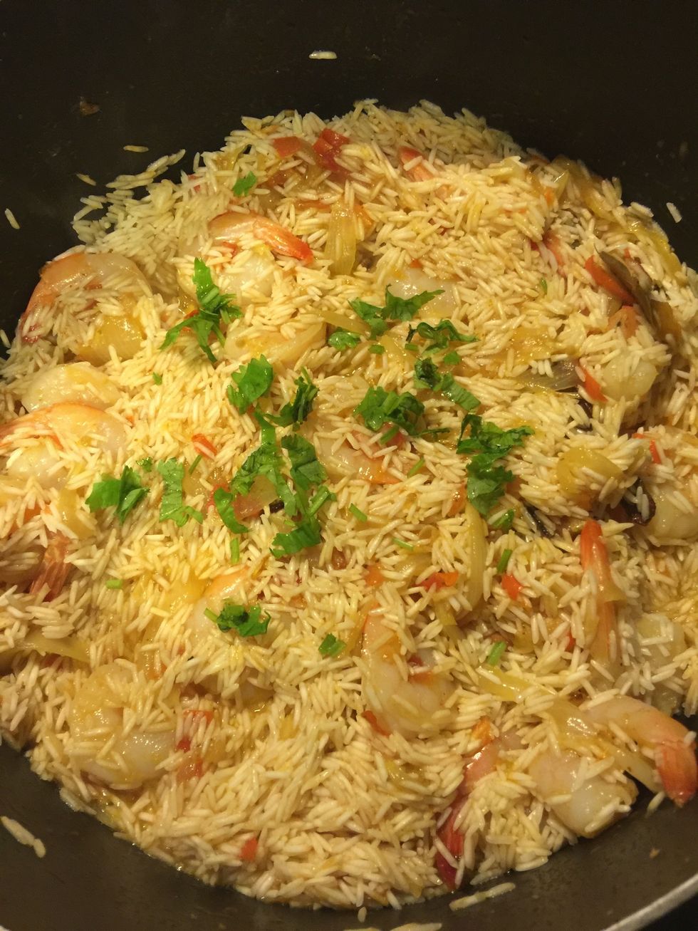 mix well, and add chopped cilantro. i like to add a little cilantro while cooking and use some for garnishing once the pulao is ready.