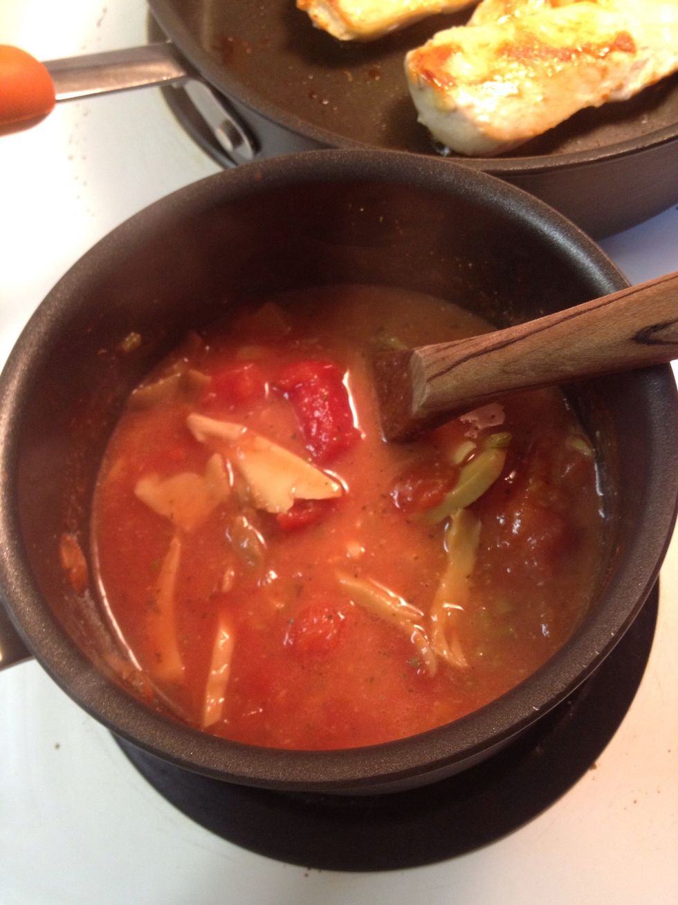 Mix well. Bring back to a boil for two minutes. Keep stirring. This will help thicken the sauce a touch.