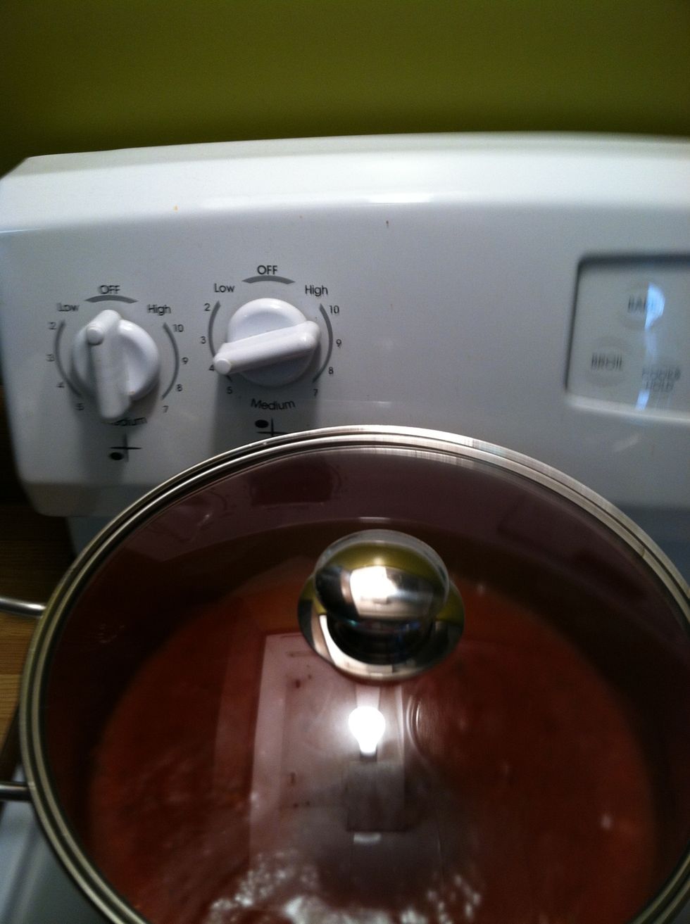 Mix well (I like to use a wooden spoon) and simmer on med- low while we prepare the meatballs.