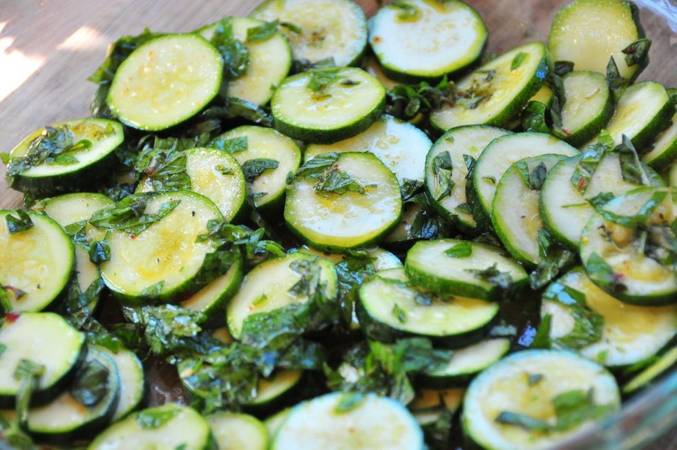 Mix well, making sure there is plenty of oil covering the zucchini. Lots of oil is great in this recipe so don't be shy with it. Besides, it's great for dipping bread in after the zucchini is gone!