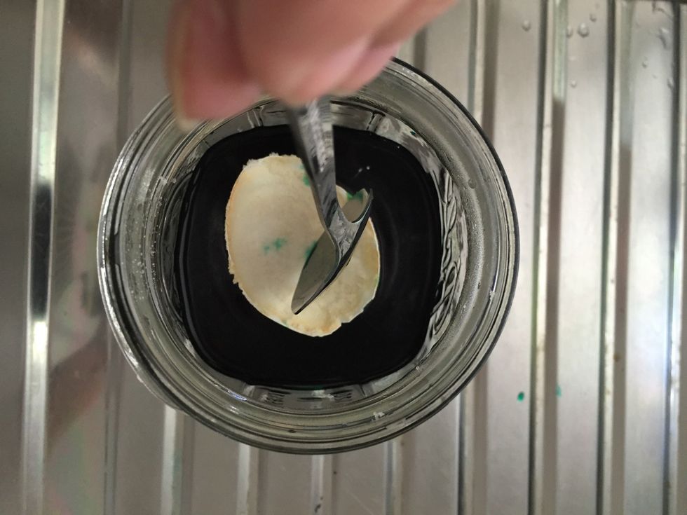 mix well then slowly submerge egg into the liquid. leave overnight. the longer you leave it, the more crystals will form.