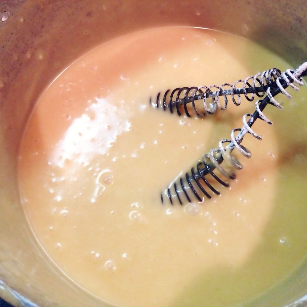 Mix with an electric mixer, adding more confectioner's sugar or cream, until smooth and creamy.