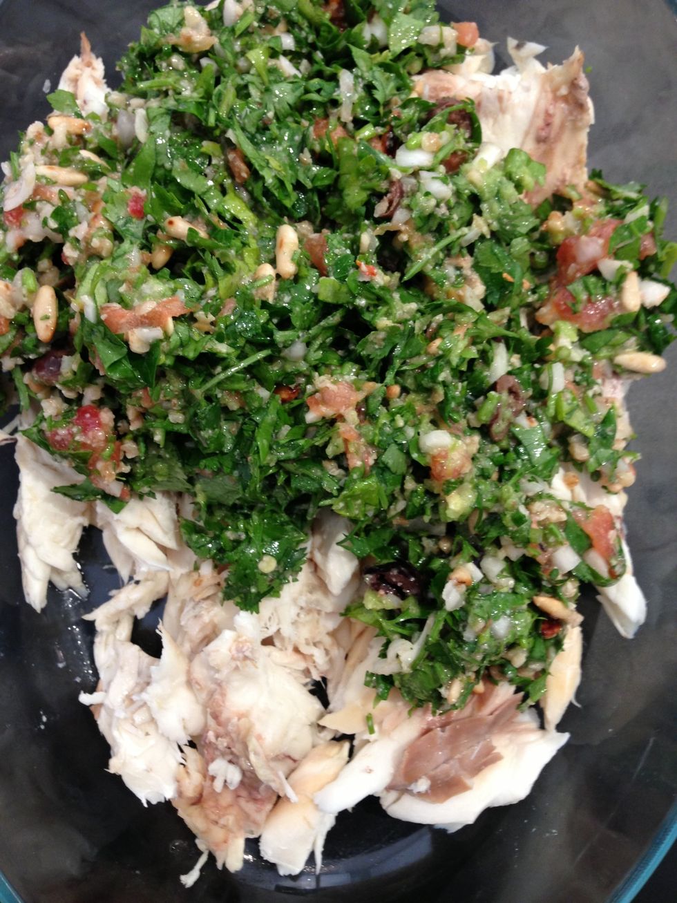 Mix with the uncooked relish. And in a serving dish that can b used in the oven or in the microwave, reconstitute the shape of the fish. Heat for 2 mins in the microwave and serve warm .
