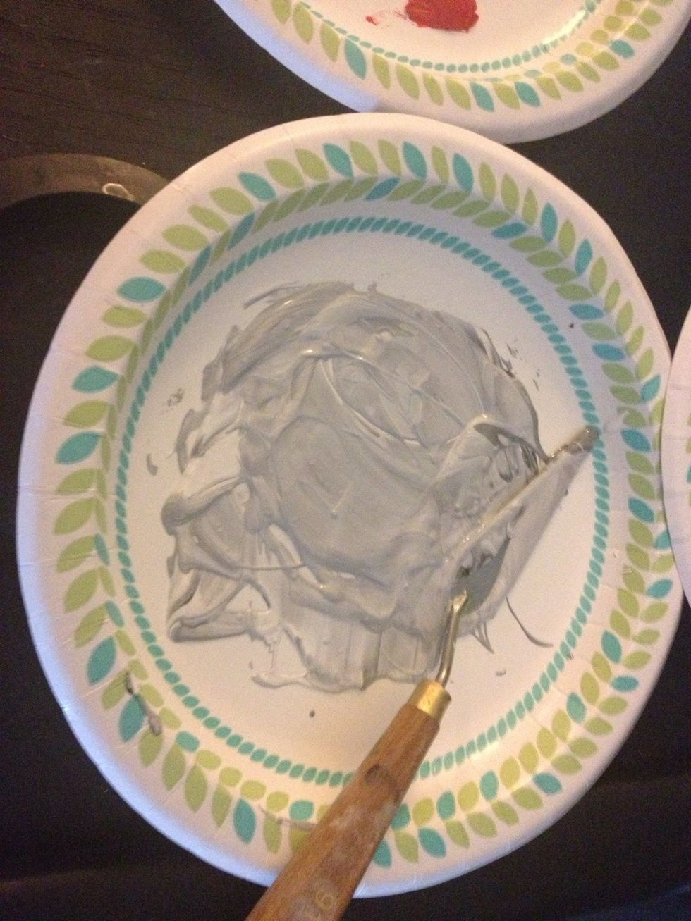 Mix your liquid white and liquid black together to form a gray. Scrub a thin, even coat across the entire canvas with your large chip brush.