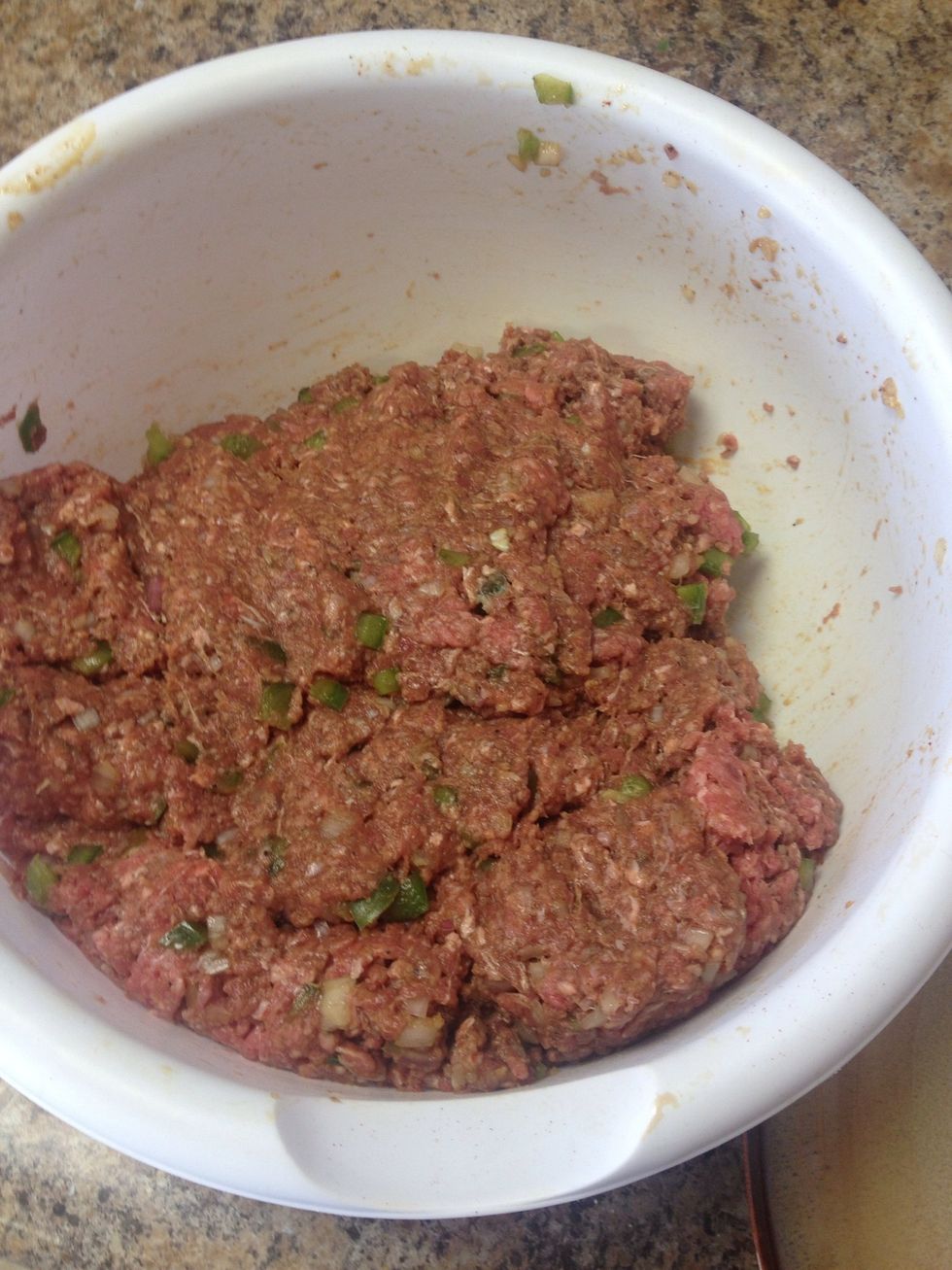 Mix your meat now that you have a minute to breath. By hand is how I do it.