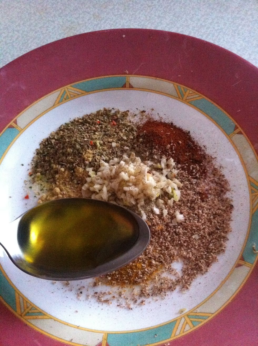 Mix your spices with 2-3 table spoons of olive oil or lemon juice or mayonaise or soy sause or any other sauce of your choice )