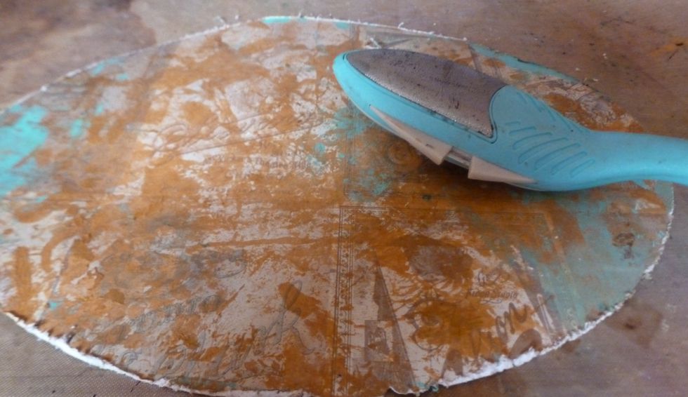 Mixed TH bronze and vintage photo distress paint with molding on craft mat. I dipped the paper onto the craft mat to get a random pattern. Repeat with patina. Once dry, distress edges.