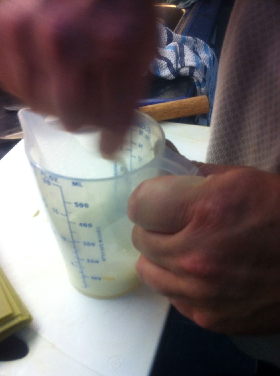 Mixing the corn flour with cold milk. Why: it's a thickener process. A little bit of milk and it's not the milk that had the carrots inside