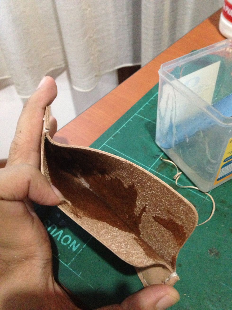 Moisten the inside of the leather using gum tragacanth, you can subtitute the gum tragacanth with warm water but sometime it get a little wrinkle when it dries so i prefer gum tragacanth..