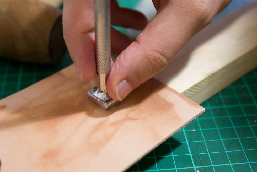 Moisten the leather and apply stamp (optional)