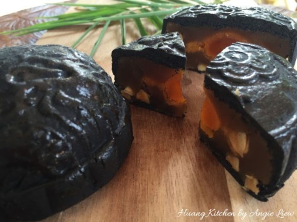 Mooncakes are enjoyed in small wedges with freshly brewed Chinese tea so cut into small wedges before serving. Enjoy! For more, visit http://www.huangkitchen.com/baked-bamboo-charcoal-mooncakes/