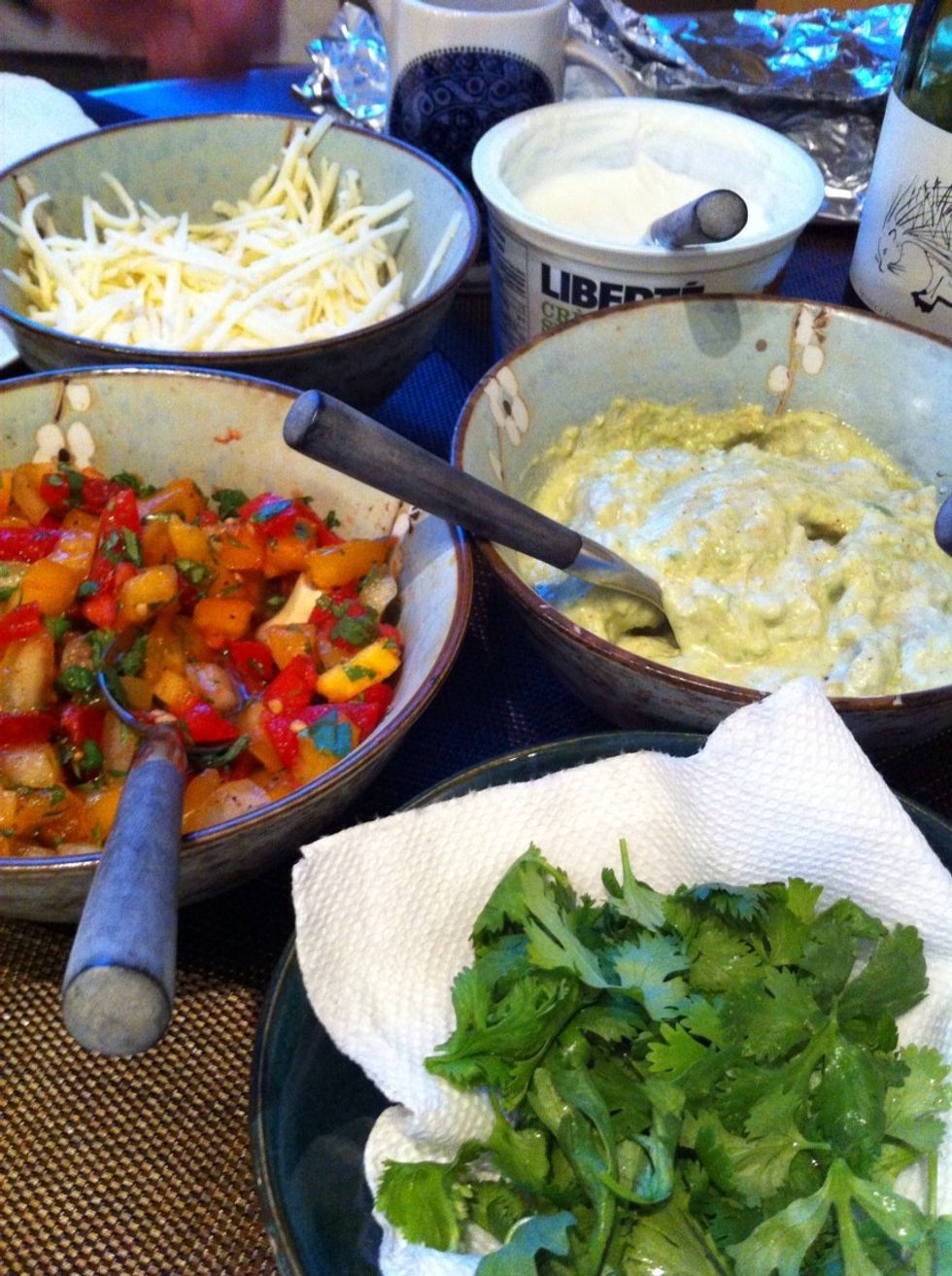 More cilantro. Guacamole. Cheese. Warmed corn tortillas.