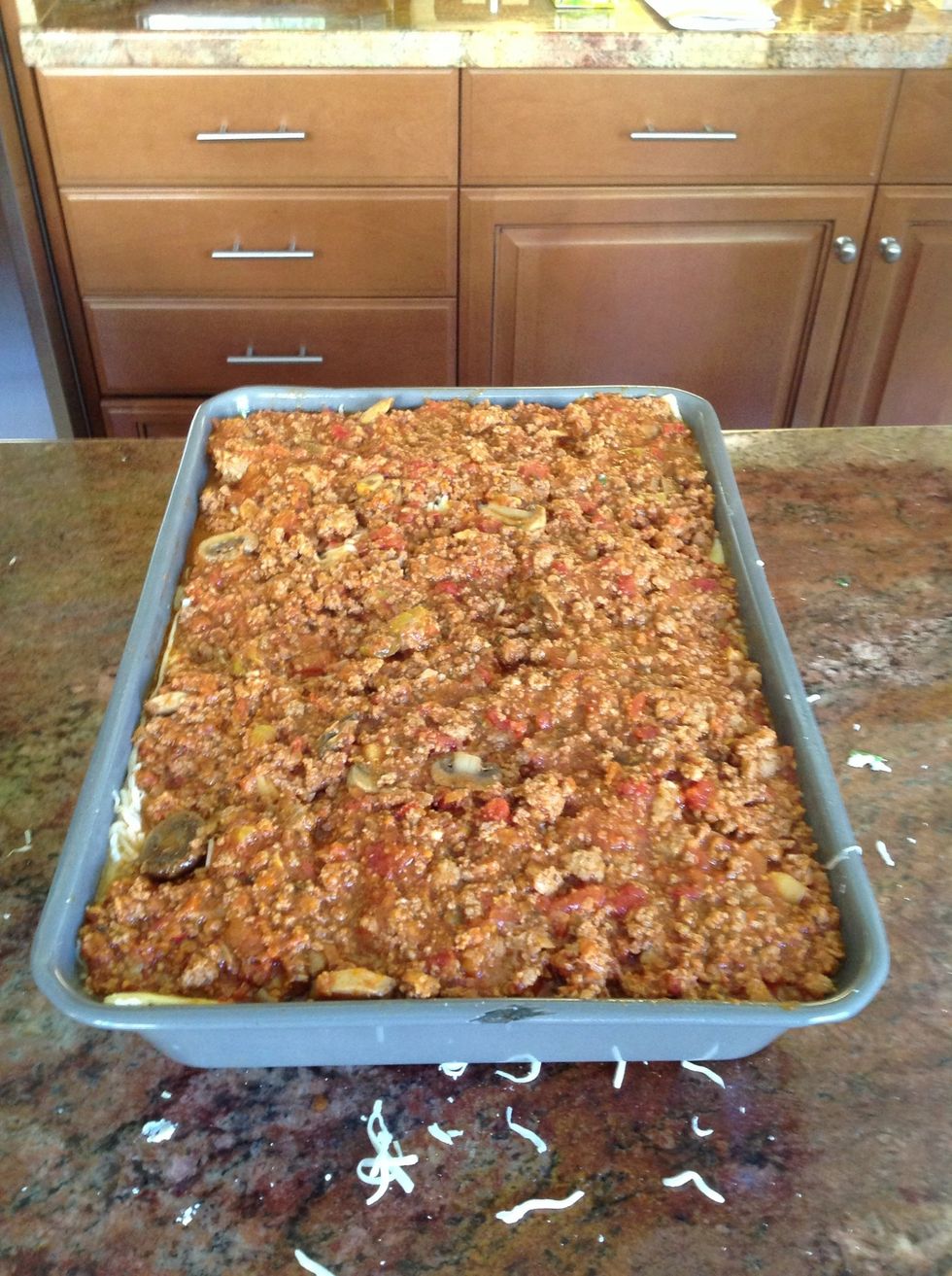 More Pasta sauce. Get the corners good.