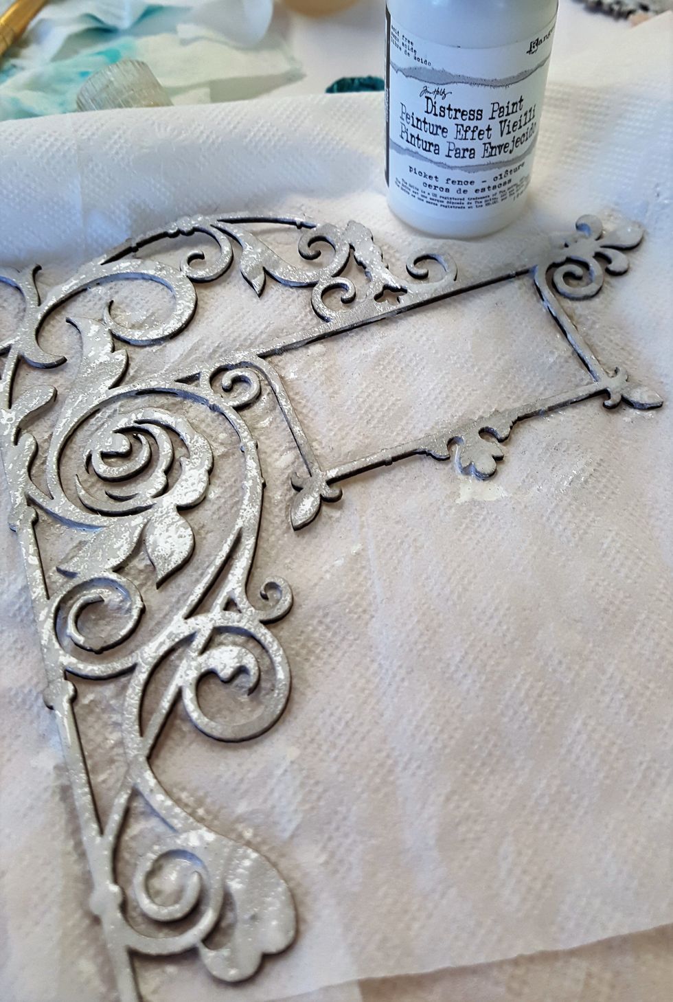 More white paint for the chipboard embellishment from Blue Fern Studios. Later, I used some light gold acrylic paint to add some highlights here and there.