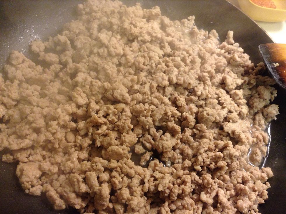 Most but not all of the water/juices from the pork should have evaporated. Remove from the heat.
