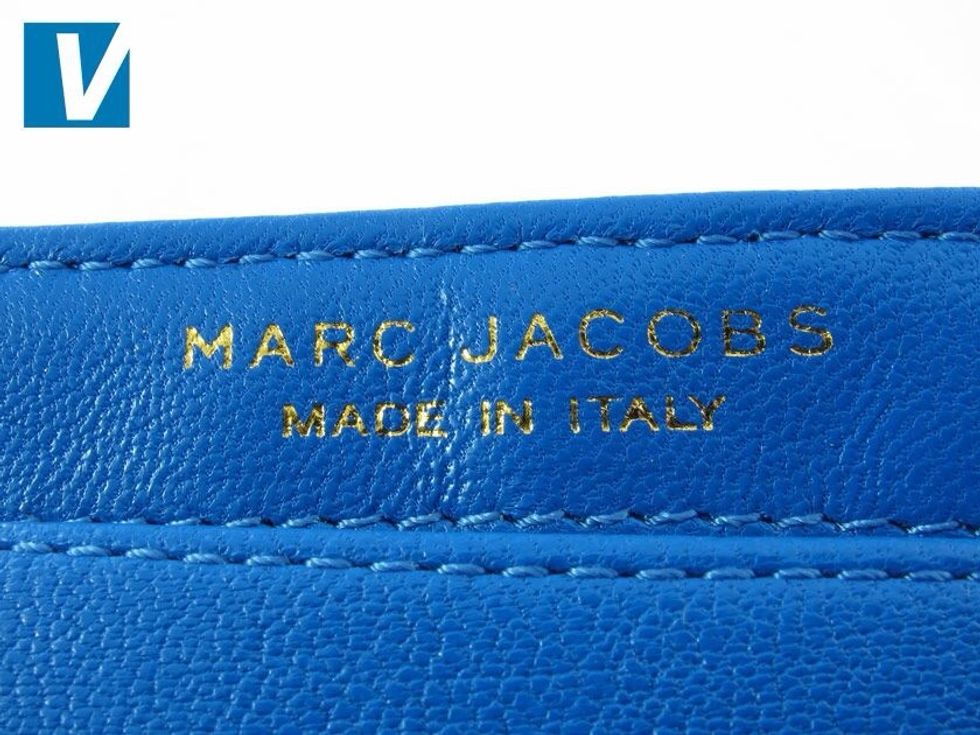 Most Marc Jacobs handbags will feature an interior brand name and 'Made in' stamp. Check that the Marc Jacobs letter font is consistent with the official brand, and that the letters are evenly spaced.