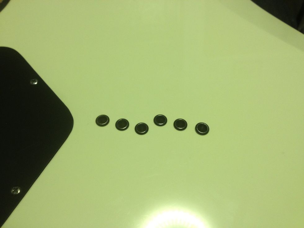 Most modern guitars have two types of string 'holders'. The one above is a string thru', and has Holes corresponded to each strong (the left one being the high E)