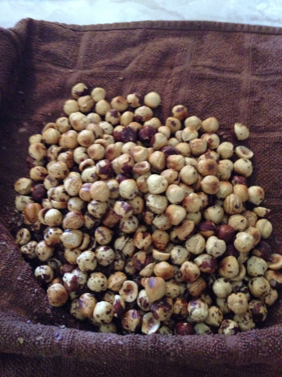 Most of the nuts should be clean. Pick off the last stubborn skins by hand or simply move on. A few skins won't hurt the spread.