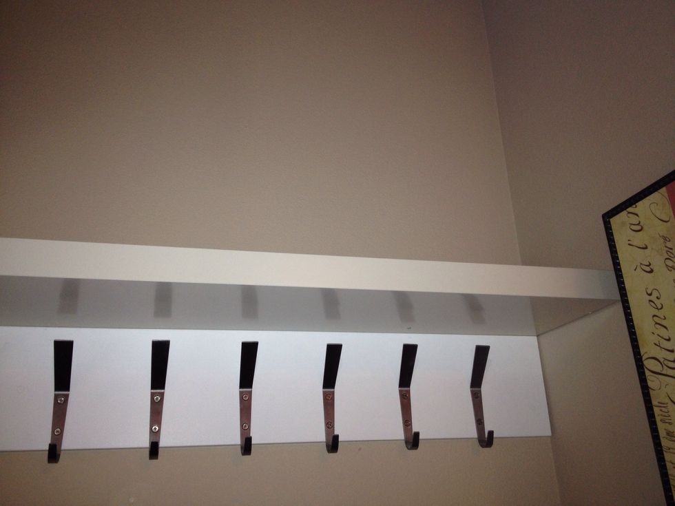 Mount shelf directly above the board of hooks