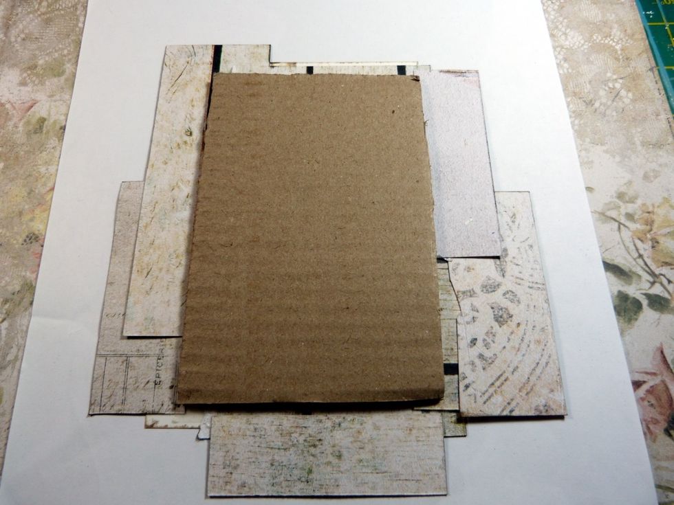 Mount the back of the photo piece with a good size piece of cardboard so it will be slightly raise off of the layout when glued on.