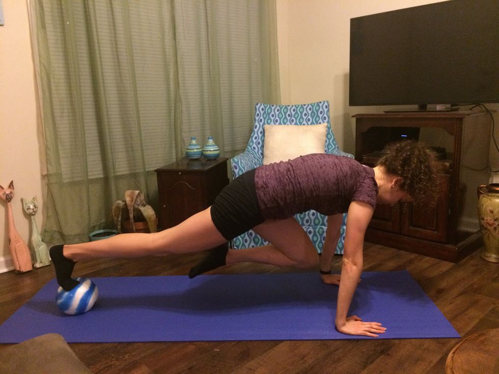 Mountain Climbers: Drive one knee up to your chest. Go back to the plank position and drive the other knee up.