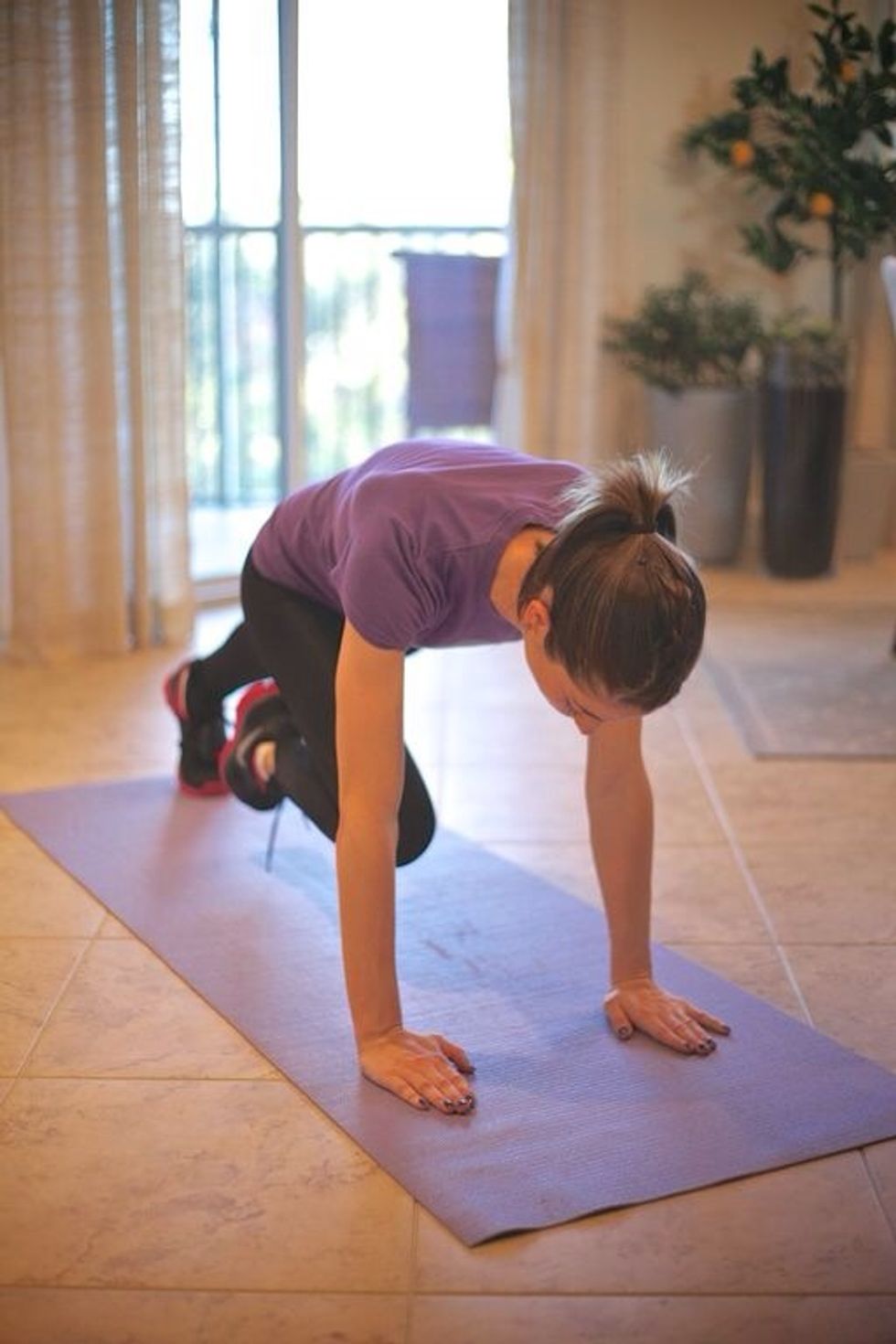 Mountain Climbers: Get in plank position and alternate bringing the right then left leg in towards the chest as fast possible. Keep torso straight and bum down. Try lowered plank for an extra workout
