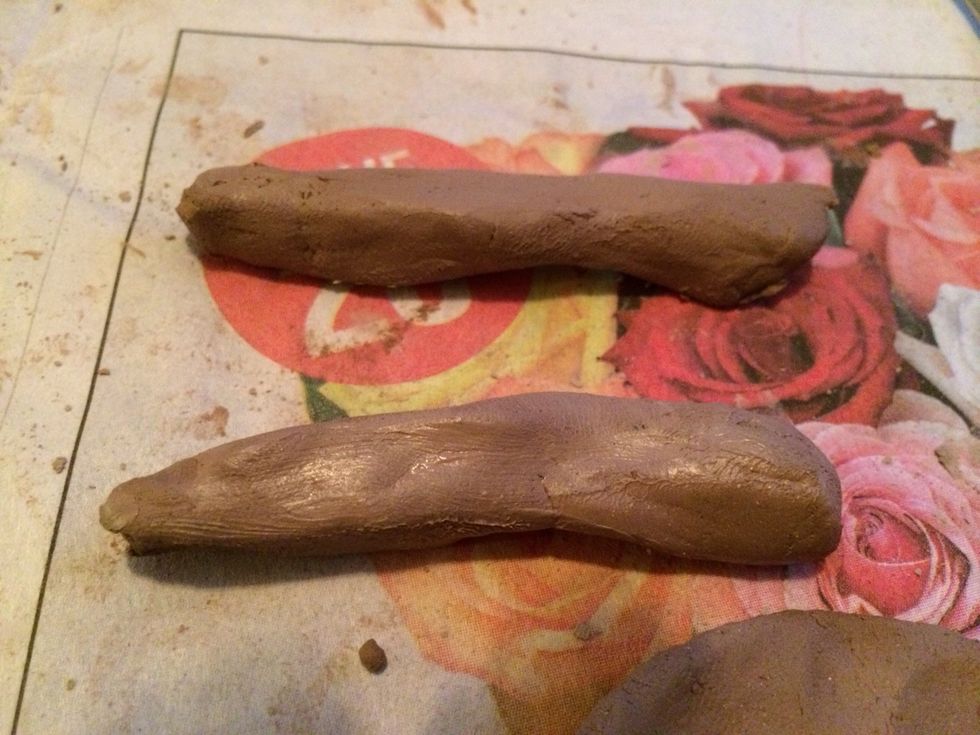 Mouth. When starting the mouth make 2 coils, one slightly thinner. Flatten the coils just a little before you add them to your clay surface. Score and slip before adding.