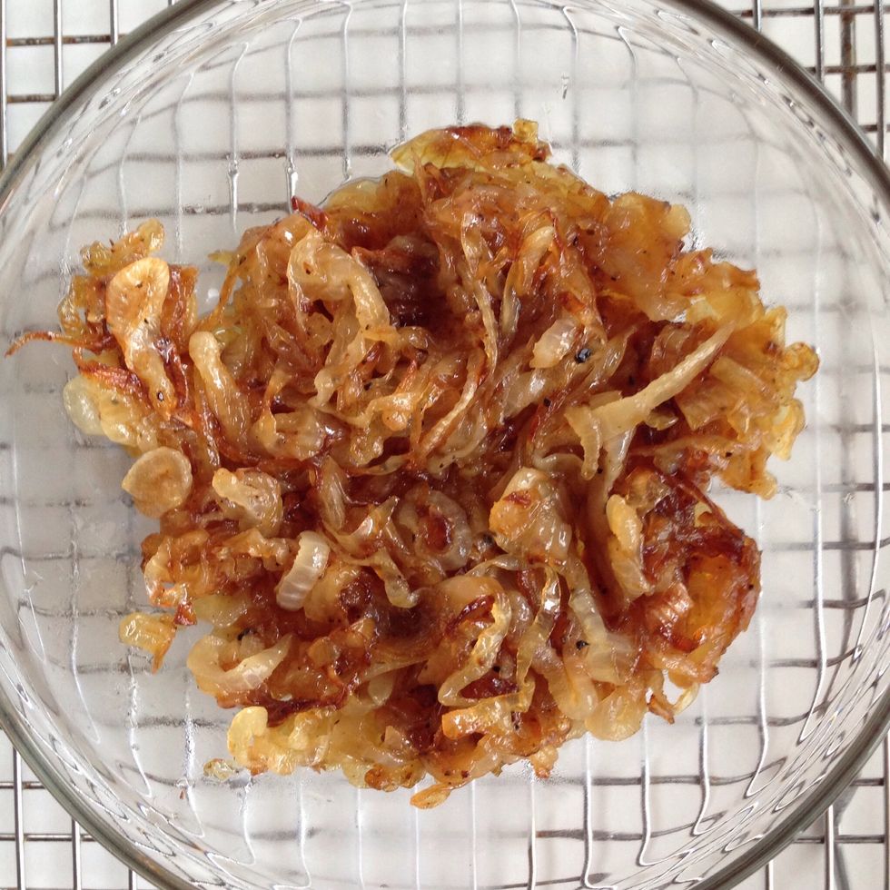 Move caramelized onions to a clean bowl for serving or to wait for their placement in your meal.
