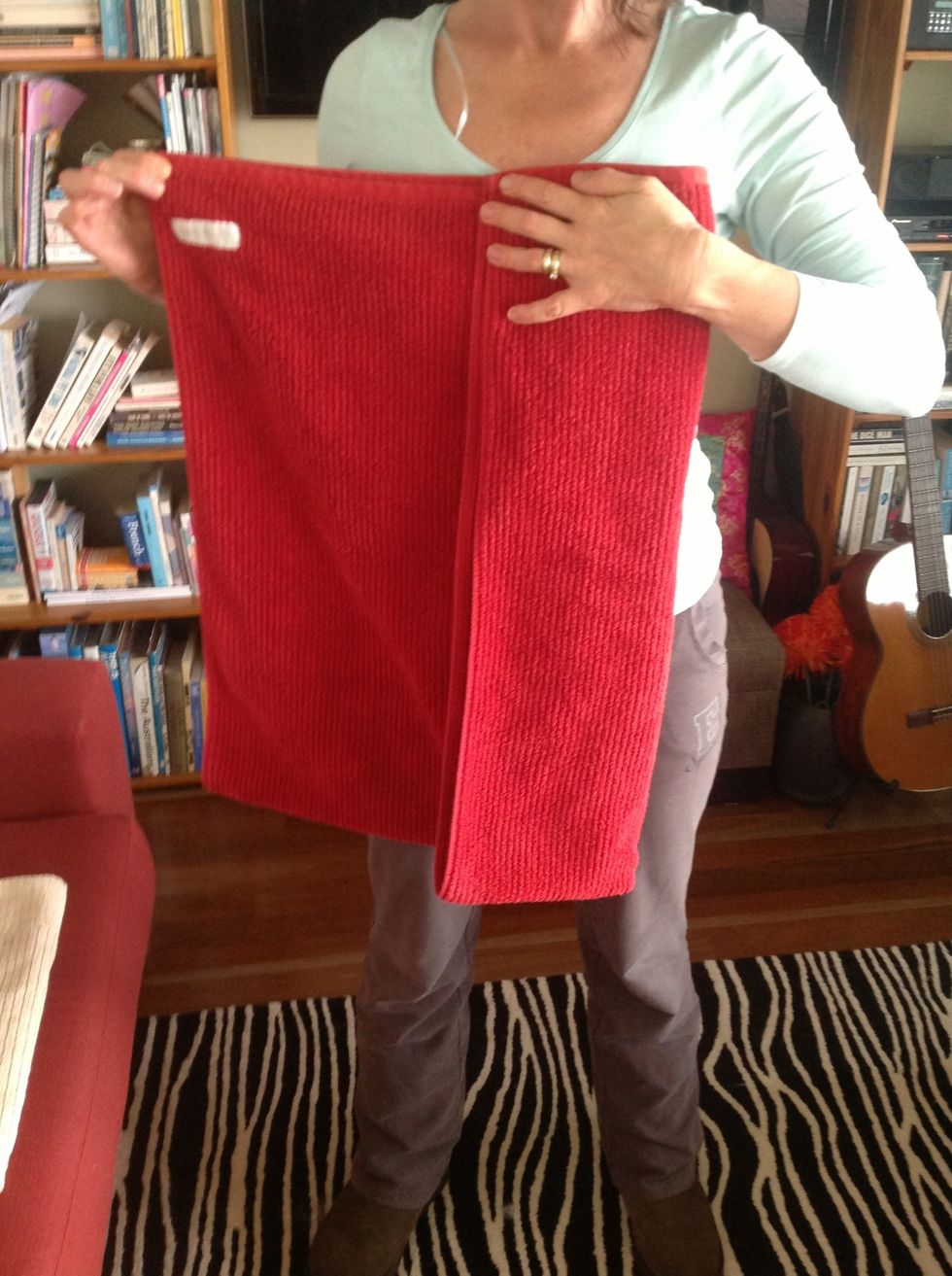 Move one side over a third of the towel