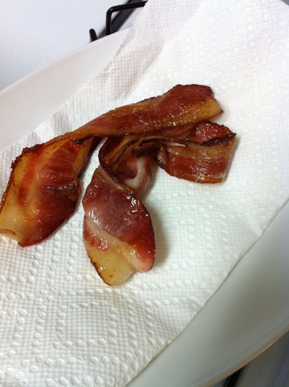 Move the bacon to a plate and set aside. We use a paper towel to soak up some of the grease