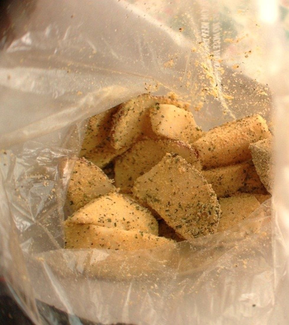 Move the fish from the milk mix into the ziplock containing the cornmeal. Seal the ziplock bag and shake until the fish have a thin layer of cornmeal on them.