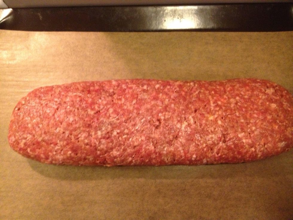 Move the meatloaf to a tin plate. Remove the plastic.