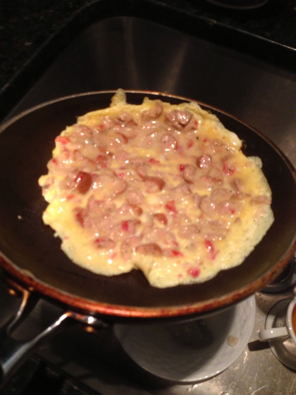 Move the omelette near the edge of the pan...