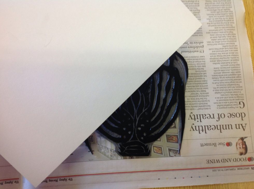 Move the stamp to a clean area, free from ink and place the paper you wish to print on, over the top of the Lino. Once the paper is on the Lino make sure it does not move around or the ink will smudge