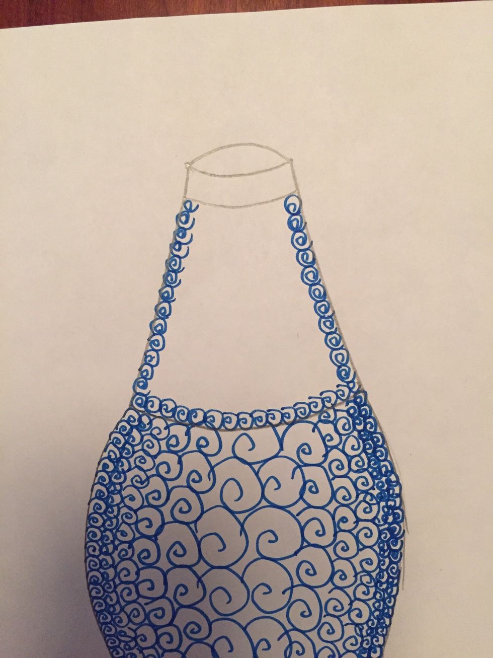 Move to the neck of your bottle. Draw your shape or symbol very small and close together along the sides and bottom of the neck.