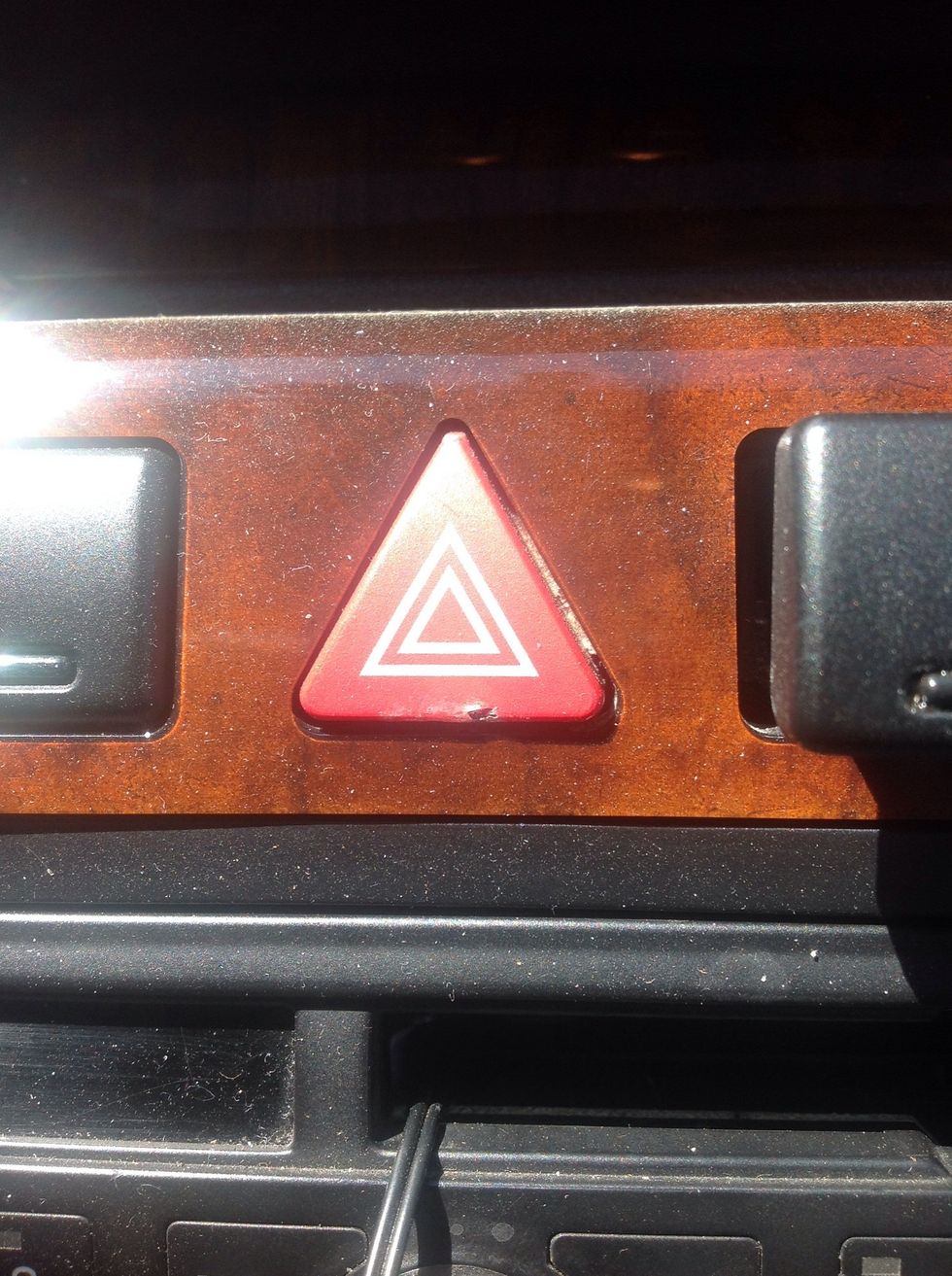 Move your car to a flat, leveled surface. The ideal location would be a driveway or garage, where you do not have to worry about traffic. If not in a garage or driveway, turn on your hazard lights.