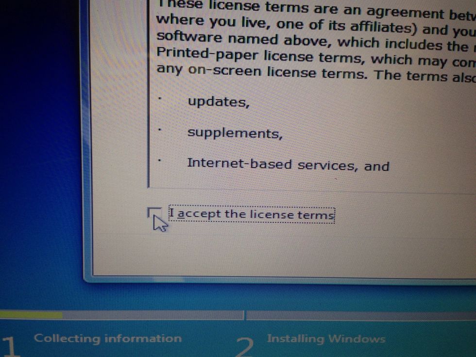 Move your mouse to the "I accept the license terms" button and click.