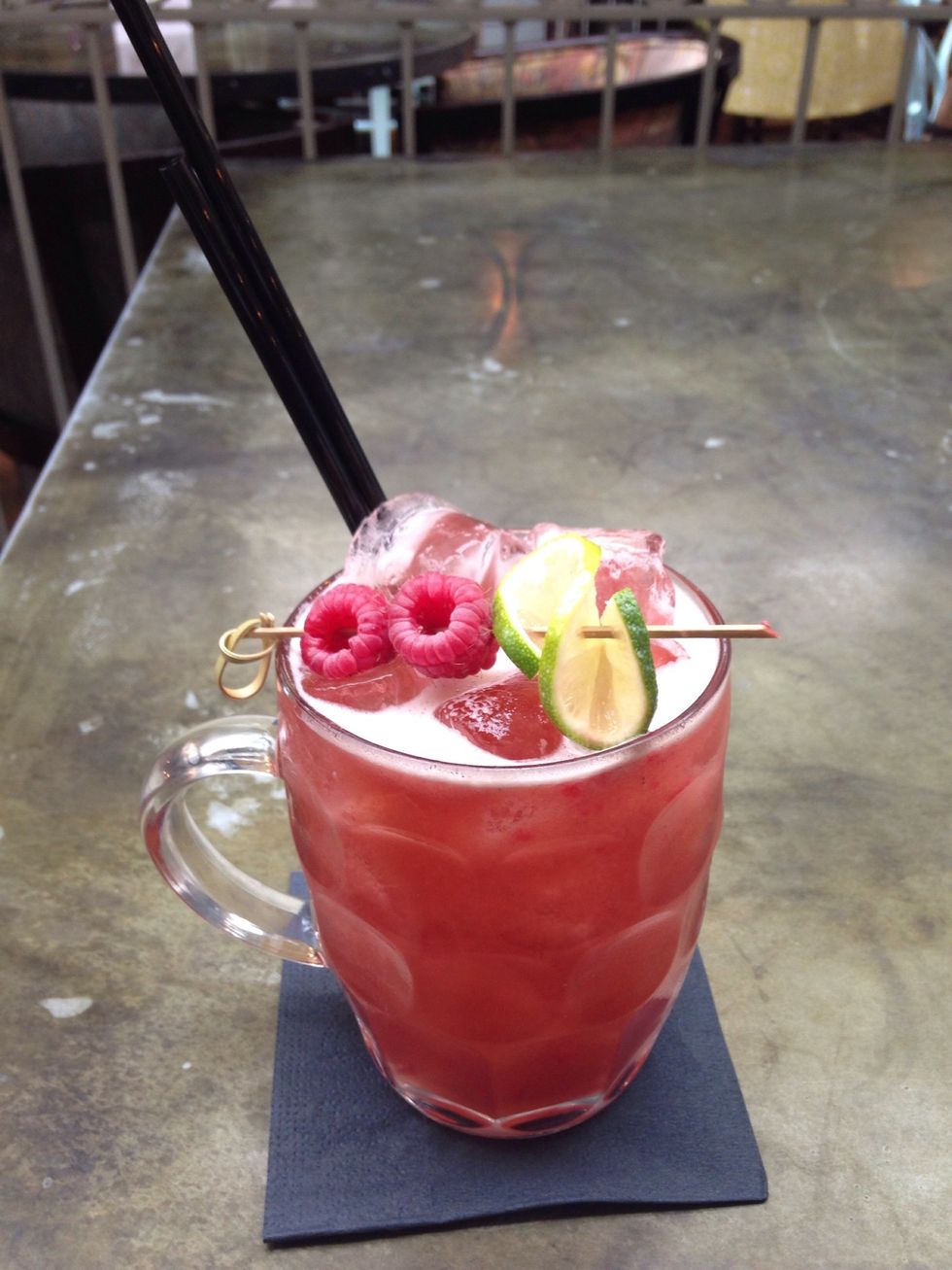 Muddle briefly with a bar spoon and then garnish appropriately.
