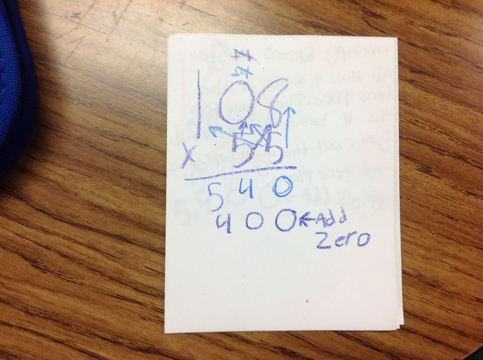 Multiply 5x0=0 then you add the 4 on the tens place.then you put the 4 be side the 0 then you X out the 4 on top of the tens place.