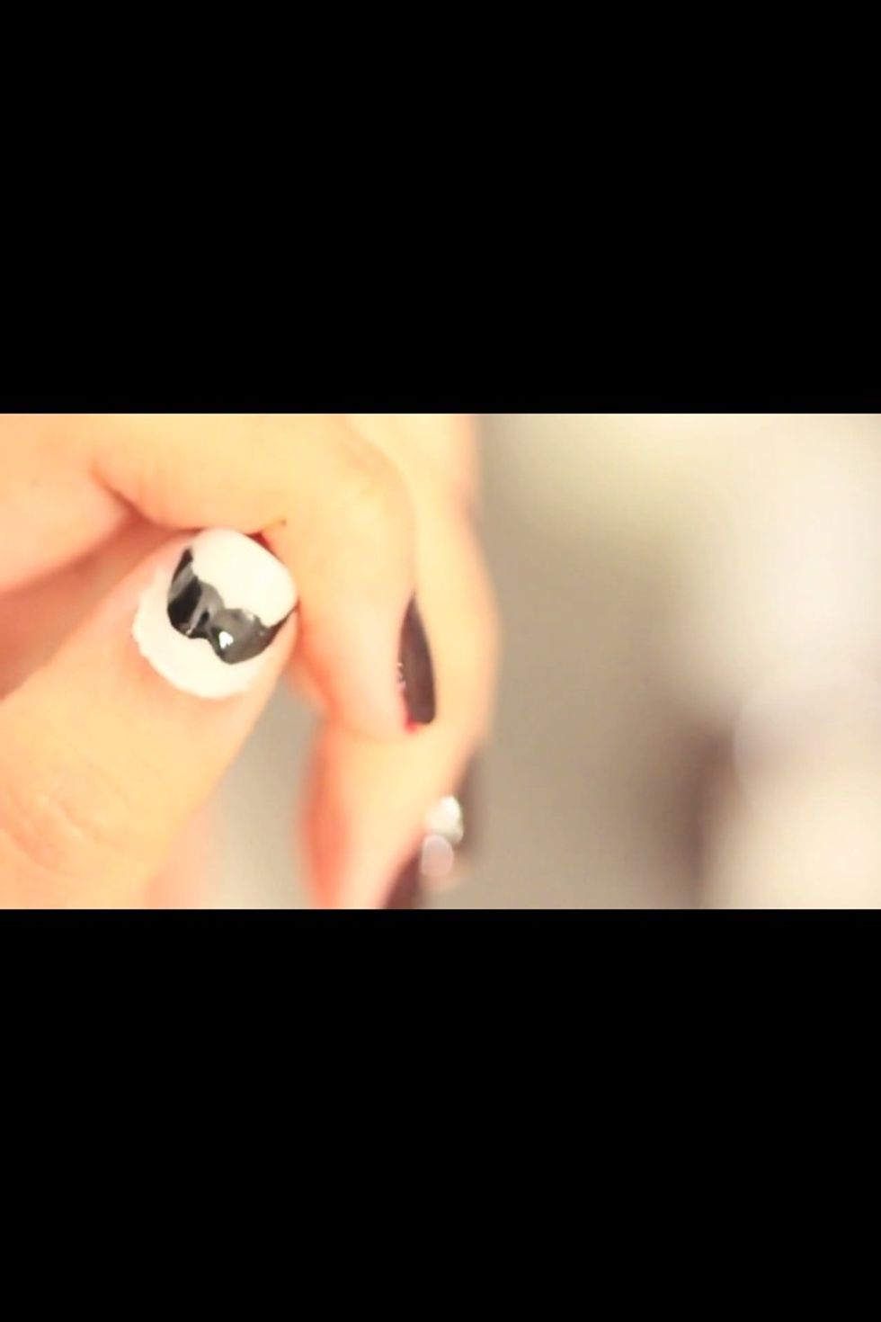 Mustache nails! You need white and black nail polish :)