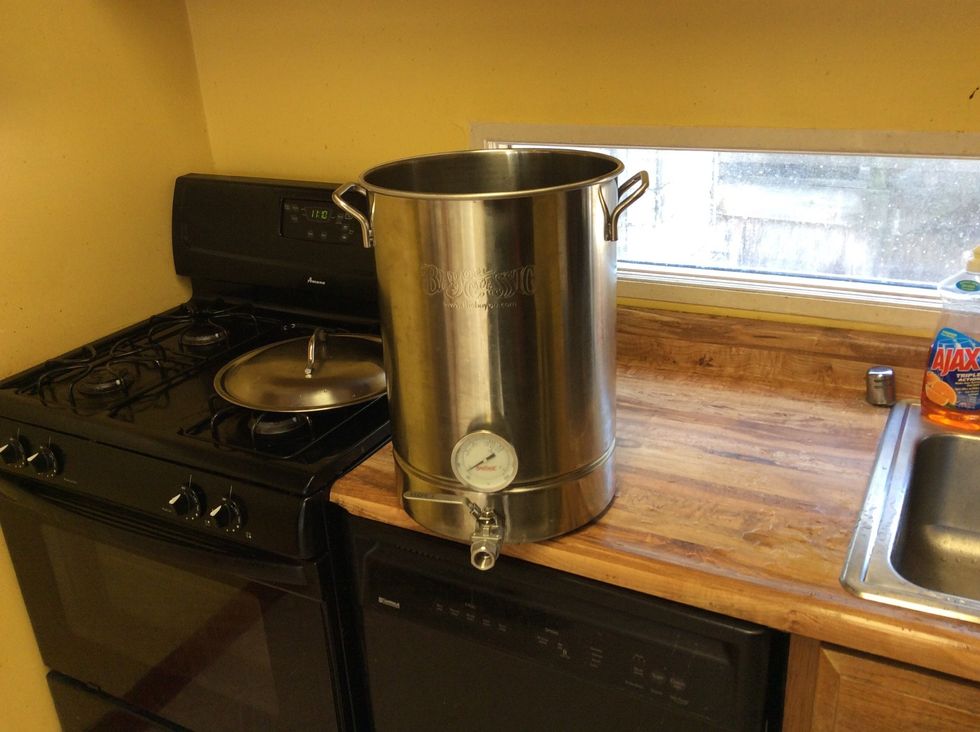 My 7 gallon boil kettle. The thermometer makes hitting the right temperatures easy. Most beginner beer kits include a floating thermometer too, so if you have a big enough pot you're fine.