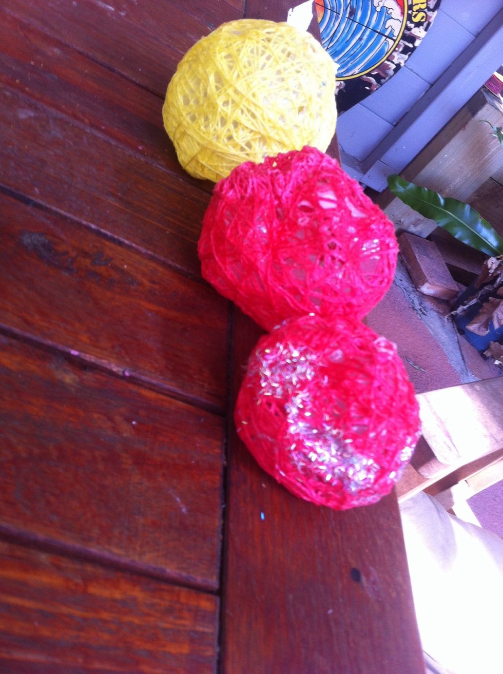 My balloons deflated in the sun:( so they seem a little warped but ill give it another go... But wjat you do next is pop open the balloons and stretch it out the top