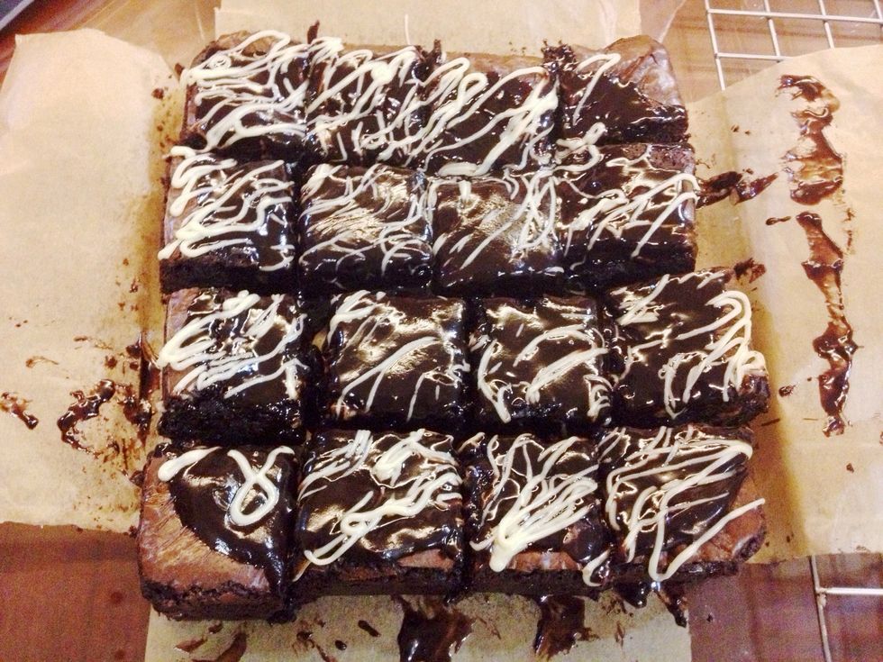 My family couldn't wait any longer so they insisted that I cut it. But since the chocolate hadn't set, it got all messy. WHO CARES THOUGH. There you go, quintuple chocolate brownies.
