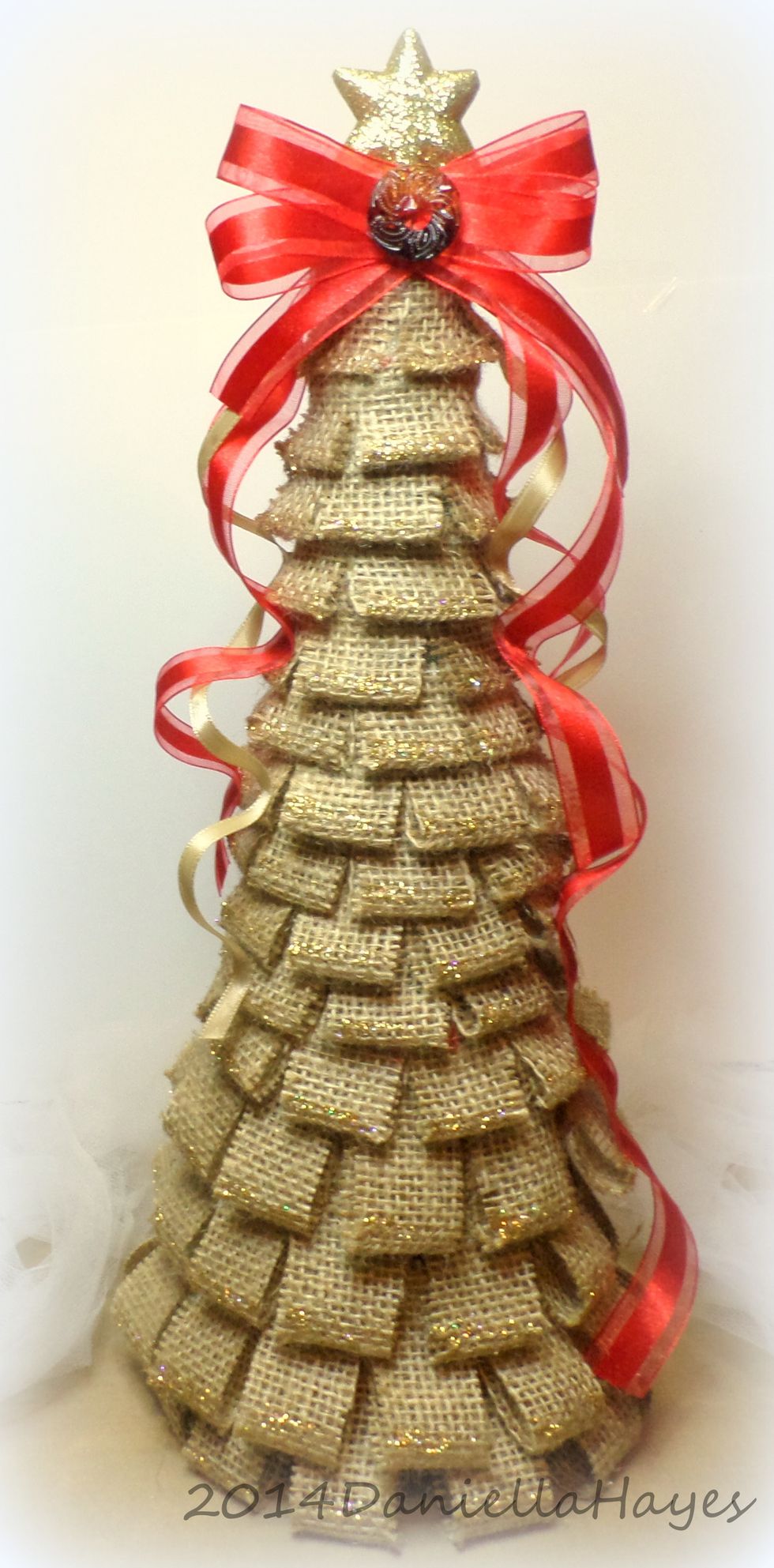 My finished tree! I added several ribbons in different lengths and colors and a big bow to the top. I love how it turned out!! Thank you so much for watching!