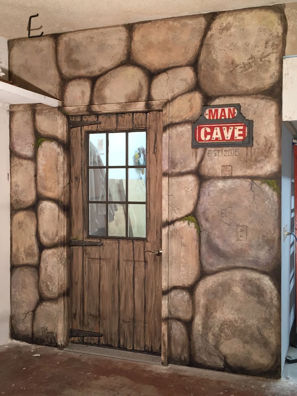 My husband gave me permission to paint the entrance to his new wood shop. This is an inside wall of our garage in front of where I park my car, leading to his shop. We were calling it his Man Cave...