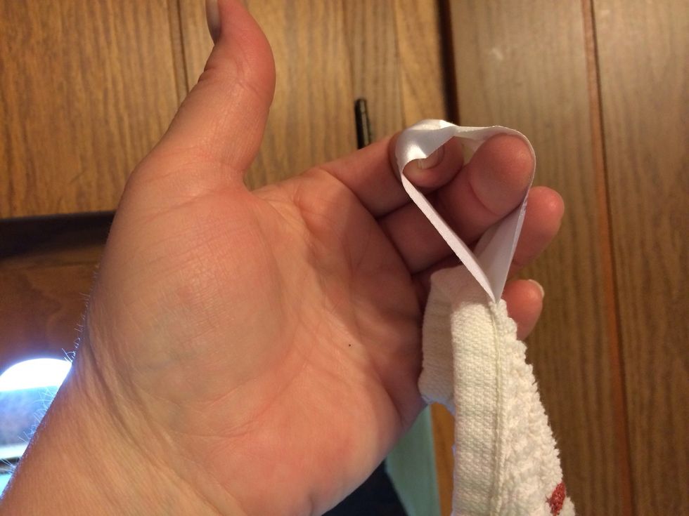 My kitchen towels don't have hooks so I use the tag. Open it up....